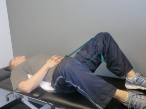 "Fallouts" with resistance band. This exercise works on the hip muscles after hip replacement