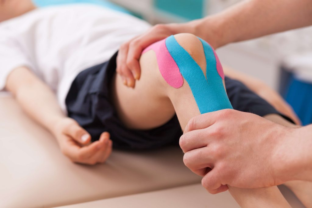 Kinesio Taping for ACL Injuries in St. Peters, MO shutterstock 346623602 knee pain treatment in ellisville