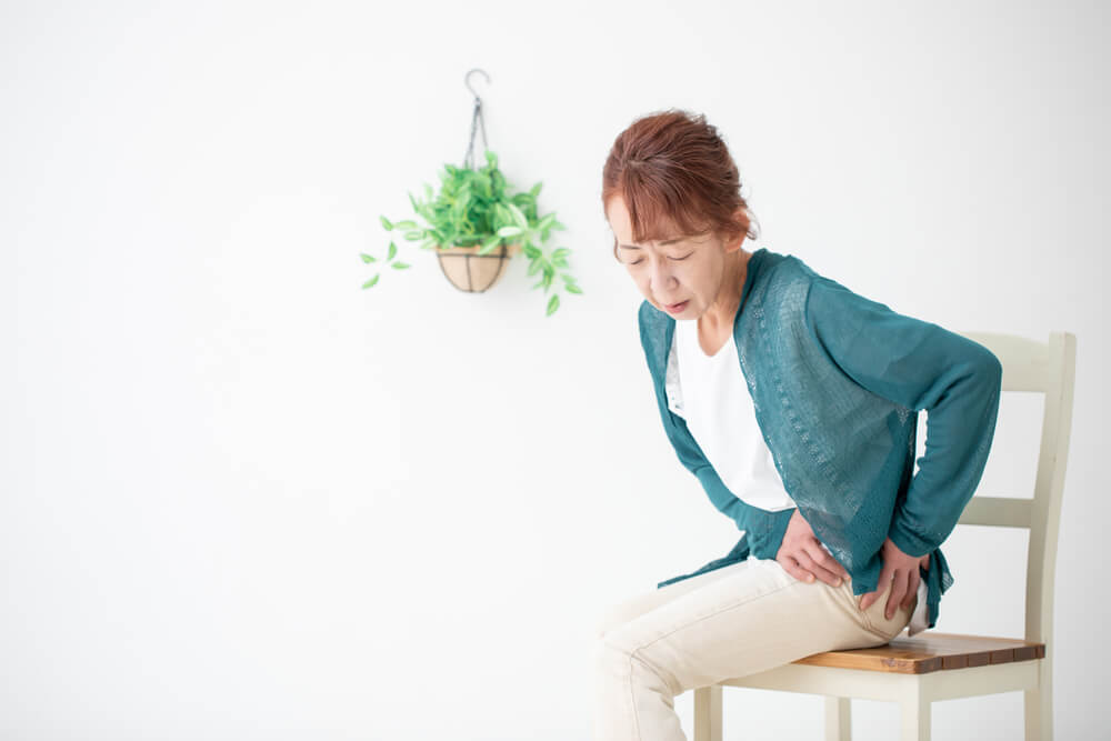 Why do I have pelvic pain when sitting down and what can I do about it?